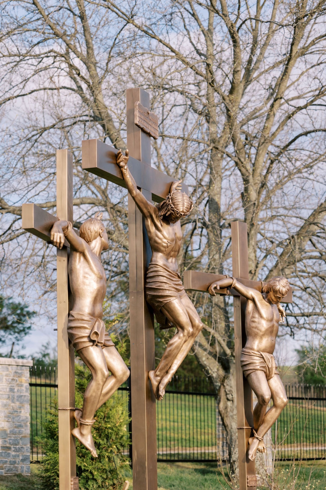 Bronze sculpture of Jesus dying on the cross — Station XII of the Stations of the Cross at the Gardens at St. Patrick’s.