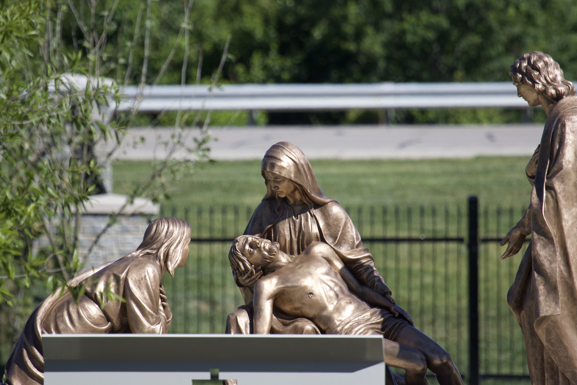 Bronze sculpture of Jesus being taken down from the cross — Station XIII of the Stations of the Cross at the Gardens at St. Patrick’s.
