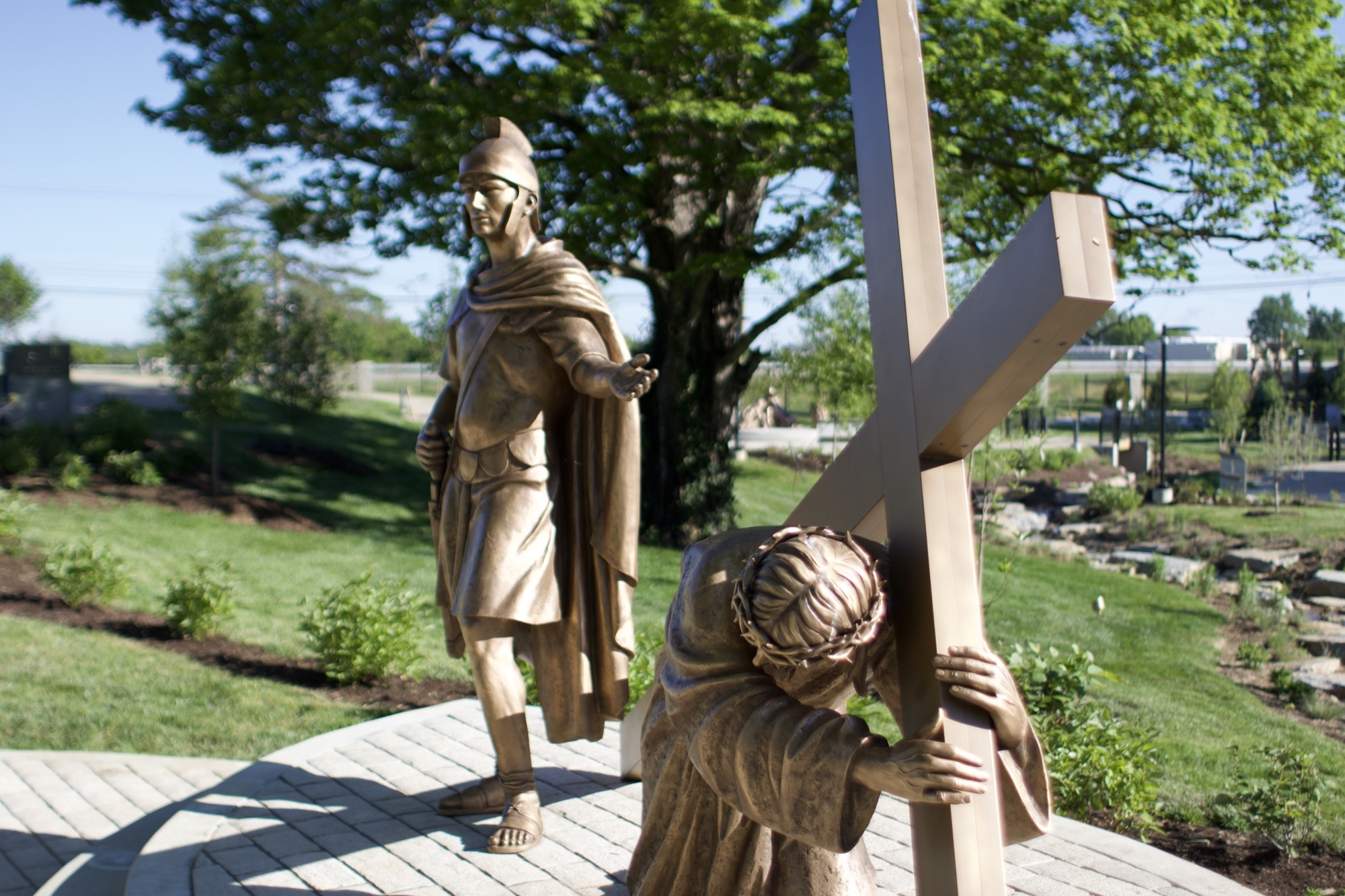 Bronze sculpture of Jesus falling the first time — Station III of the Stations of the Cross at the Gardens at St. Patrick’s.