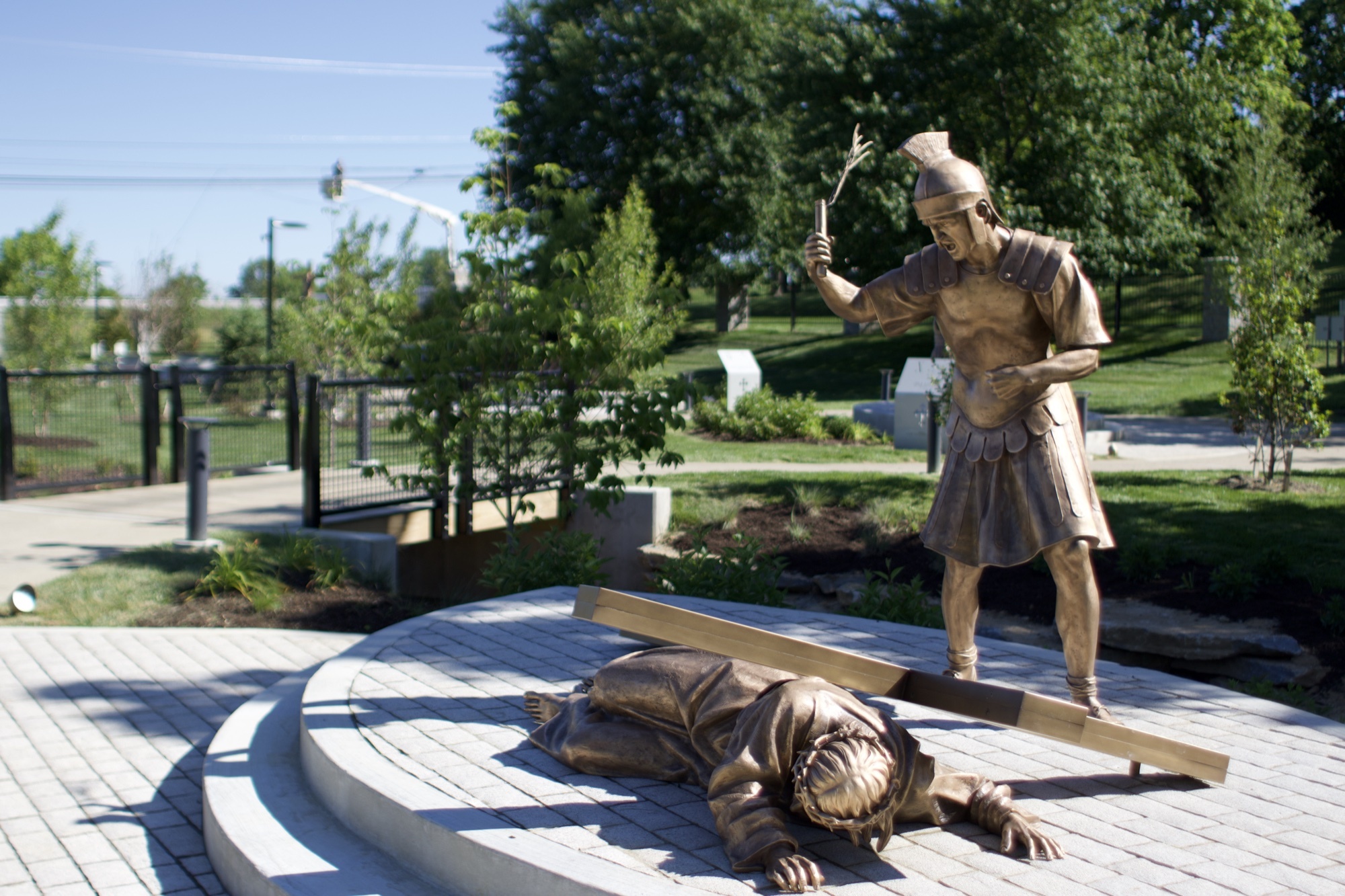 Bronze sculpture of Jesus falling the third time — Station IX of the Stations of the Cross at the Gardens at St. Patrick’s.